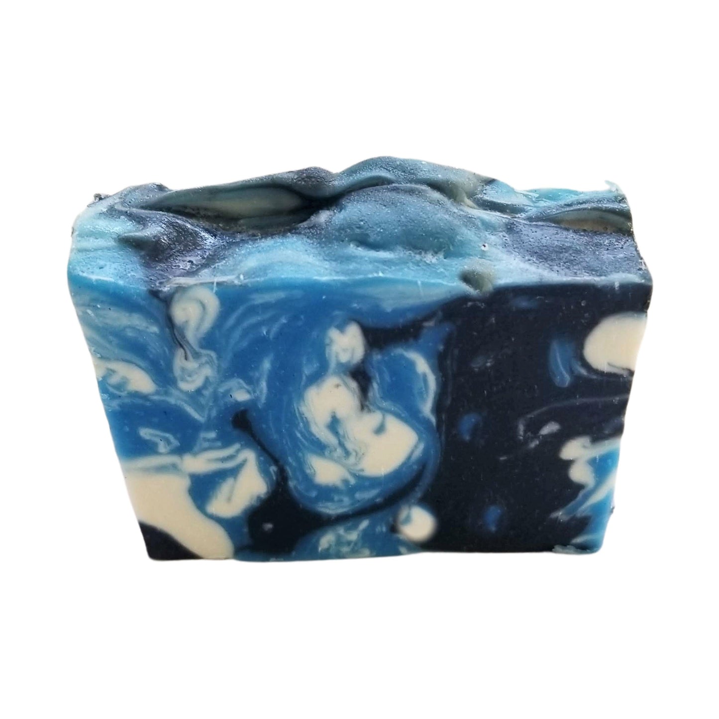 Sandalwood Spirit Soap – Earthy. Elegant. Enchanting a handcrafted, cold-process bar that soothes the soul and skin alike. Swirled in deep oceanic blues with activated charcoal and kaolin clay