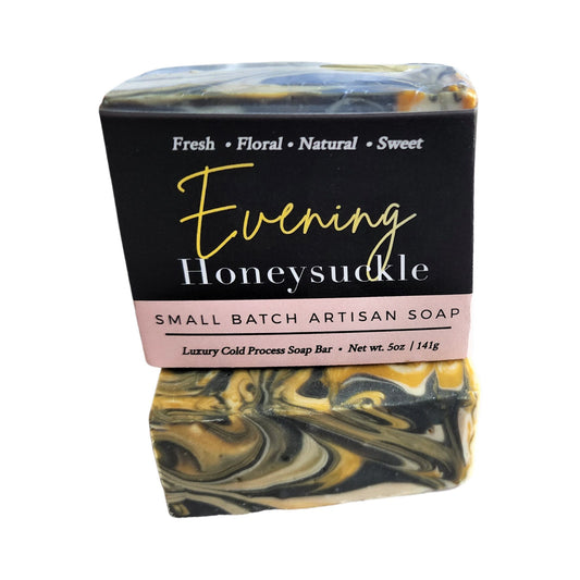 Evening Honeysuckle Soap - captures the soft, floral sweetness of honeysuckle in the evening air. Featuring rich yellow, beachy white, and gunmetal grey swirls.