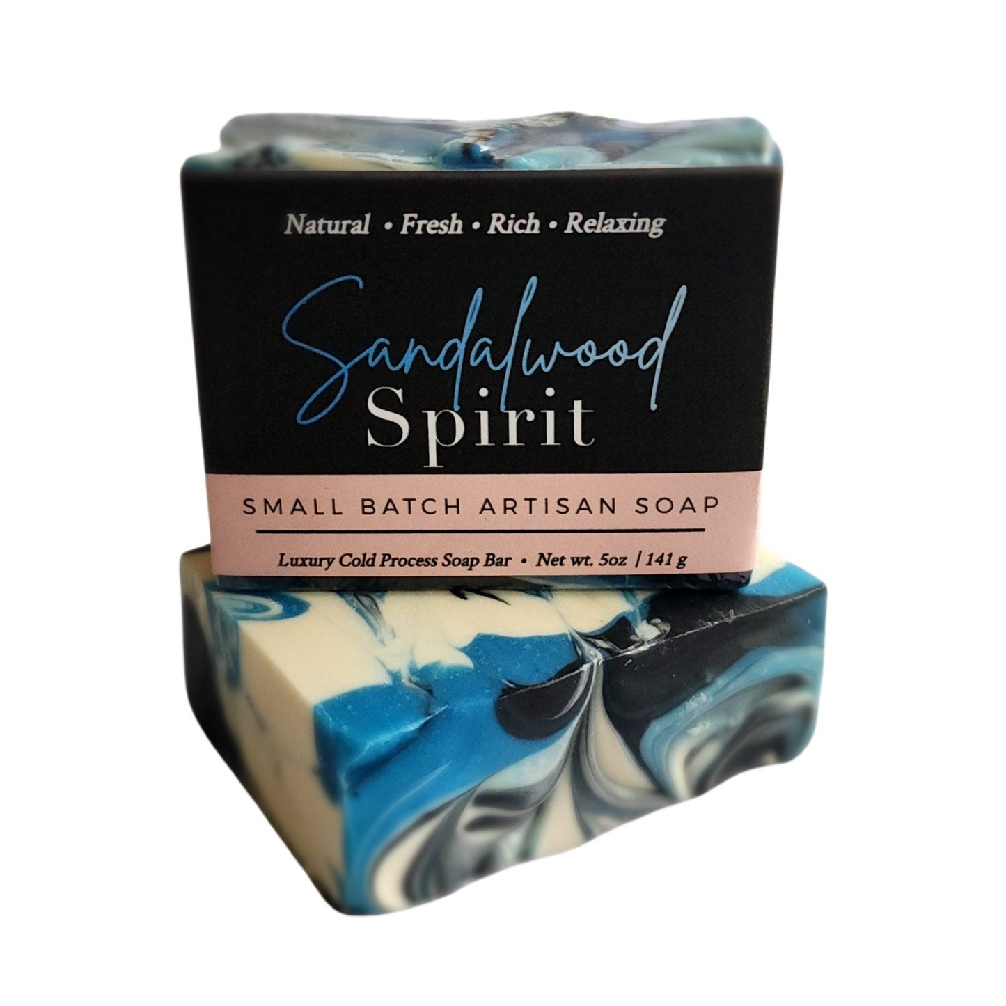 Sandalwood Spirit Soap – Earthy. Elegant. Enchanting a handcrafted, cold-process bar that soothes the soul and skin alike. Swirled in deep oceanic blues with activated charcoal and kaolin clay